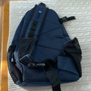 Aurorae backpack single sleeve. 4 zip compartments navy blue. Bottle holder